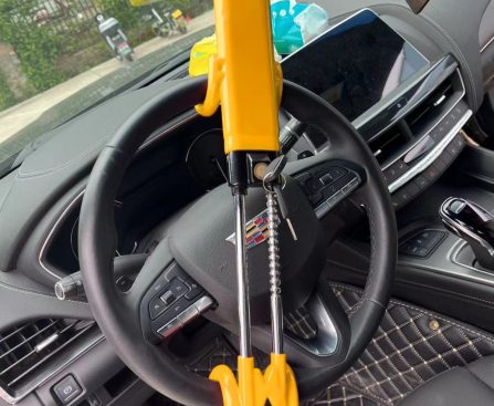 QC001 adjustable double-hook steering wheel lock installed in a car